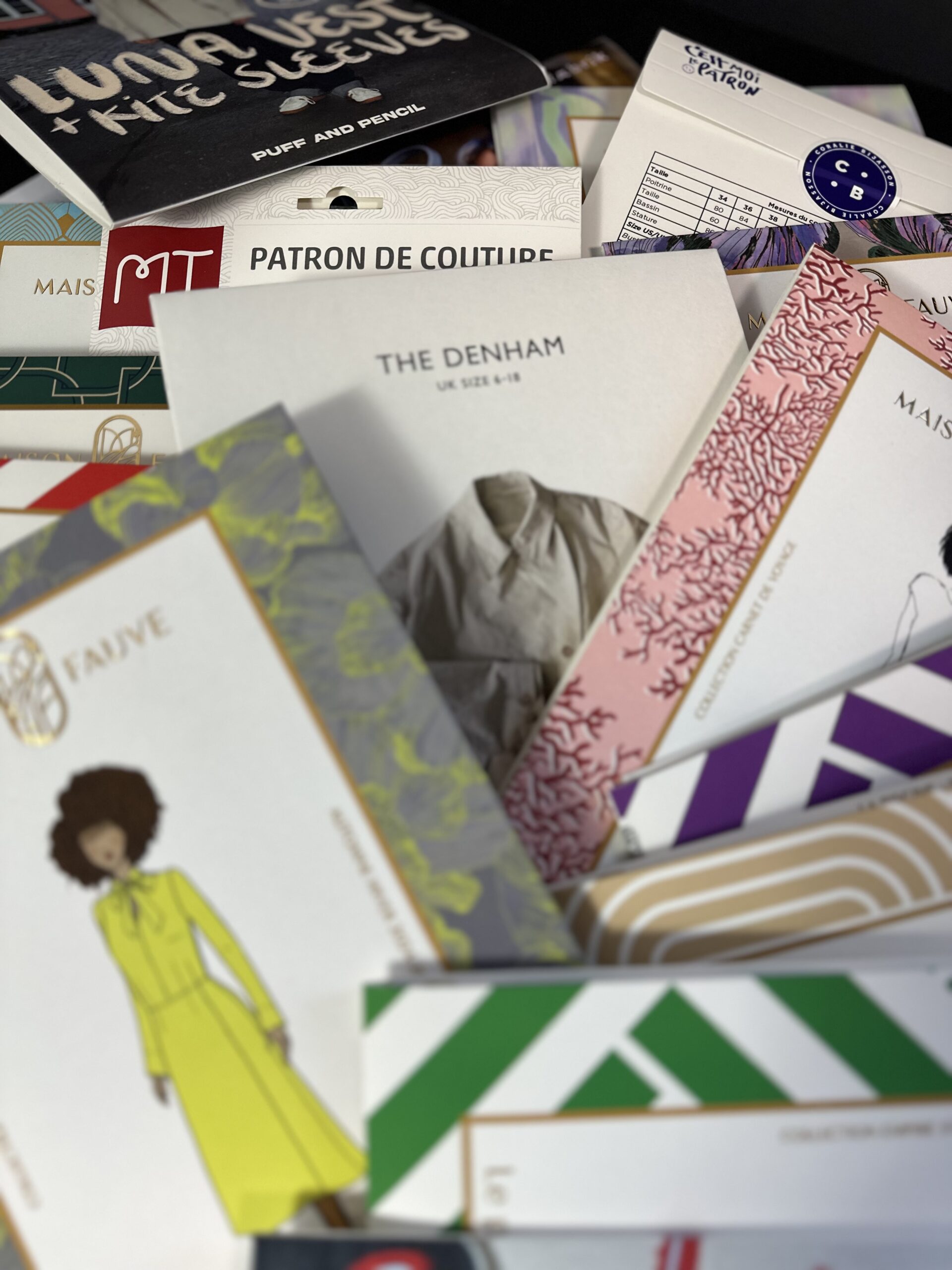 finished physical sewing pattern sets ready for packaging and distribution